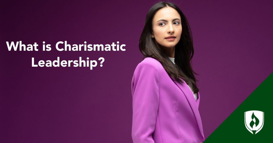 A Business Leader looks over her shoulder in a purple blazer