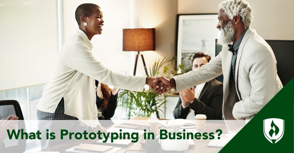 prototyping in business header Two business people shake hands over a prototype