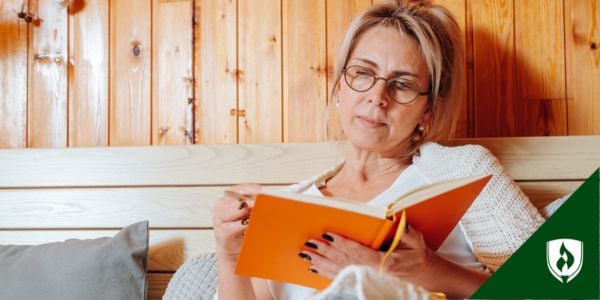 An ECE teacher sits with an orange journal