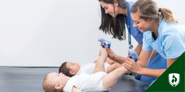 A PT and PTA work with babies in therapy