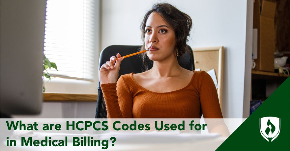 HCPCS codes header A medical biller looks at her computer in a bright office