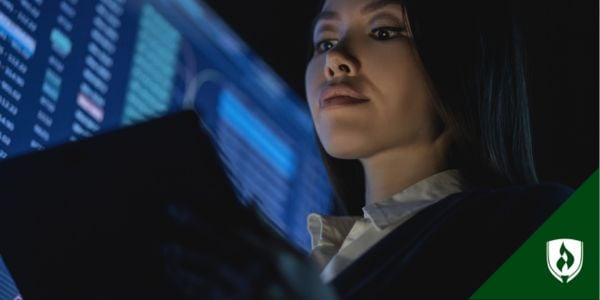 A criminal investigator looks at her tablet