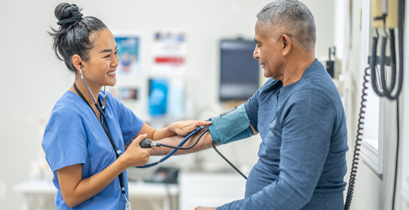 med asst_career outlook_585x300 Medical assistant taking blood pressure of a male patient